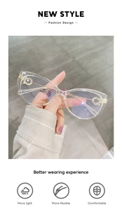 Close-up of cat-eye frames with gold metal temples and blue light blocking technology