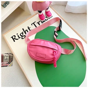 Pink child crossbody waist bag detail with smooth texture and braided zipper pull