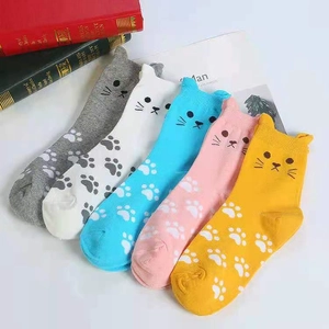 Detail showing five pairs of colorful cotton socks with 3D cat ears and paw patterns