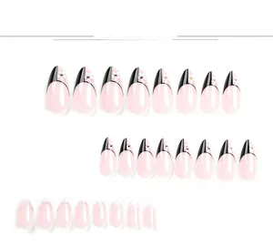 Detail view of 24pcs black French almond press-on nails with white flowers and small rhinestones