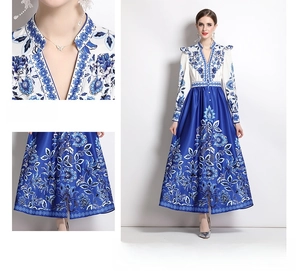 Detail of blue and white floral V-neck dress with long sleeves and flowing split hemline