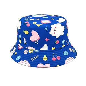 Detail of navy cotton kids bucket hat featuring white bears and colorful cartoon prints
