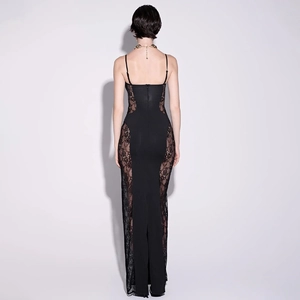 Detail of the back view of a black maxi dress featuring sheer lace side panels and a slim fit