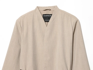 Detail of khaki blazer V-neck collar and S-size brand label with fine twill texture