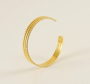 Detail view of gold stainless steel open cuff bracelet with double twisted rope texture