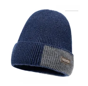 Navy blue winter knit beanie with fashion patch and thick grey colorblock detail