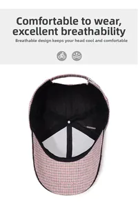 Detail of pink houndstooth baseball cap showing breathable black mesh lining and strap