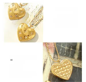 Detail of 18K gold plated heart necklace with zircon stones on a ball chain