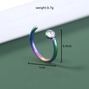 Macro shot of rainbow stainless steel piercing jewelry with clear zircon and dimensions