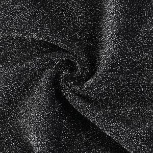 Macro detail of high-stretch black fabric with silver metallic threads and starry texture