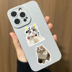 Detail of light grey silicone phone case featuring cute realistic cat decorative stickers