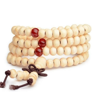 Handcrafted 108 sandalwood prayer beads bracelet with red accents and a brown silk tassel
