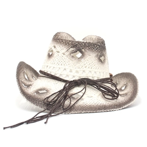 Detail of hand-woven straw cowboy hat with vintage brown gradient finish and wooden beads