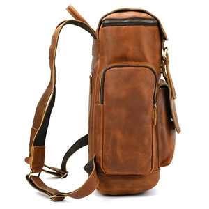 Detail view of crazy horse leather backpack showing side zipper pocket and stitching