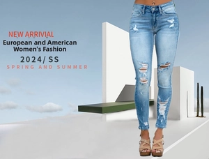 Detailed close-up of light blue distressed slim fit jeans with stylish ripped knee design