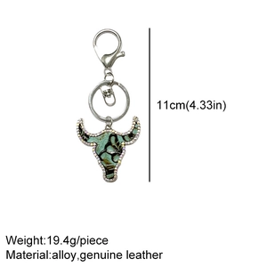 Detail showing dimensions of Western style leather bull head keychain with rhinestones