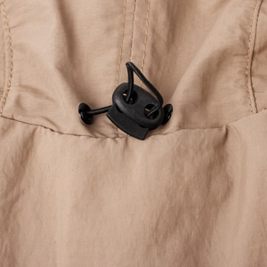 Detail of adjustable drawstring system and stitching on breathable outdoor sun hat
