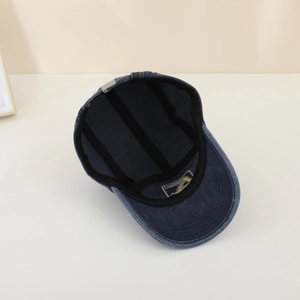 Detailed interior of vintage navy wash baseball cap showing reinforced seams and brand tag