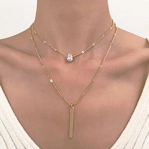 Double-layered gold necklace with water drop zircon and geometric rectangular bar pendant