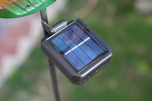 Detailed macro view of the square solar panel on a black metal stake for garden lights