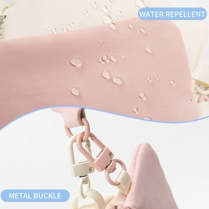 Detailed macro view showing water repellent fabric and high-quality pink metal buckle