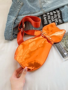 Glossy orange cat-shaped messenger bag with patent leather finish and adjustable strap