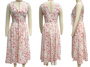 Detail of pink floral maxi dress with V-neckline, waist tie, and sleeveless A-line design