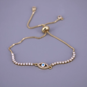 Detailed view of evil eye bracelet with blue zircon and adjustable gold sliding clasp