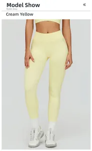 Detail of high-waisted creamy yellow seamless yoga pants shown on a model with sneakers