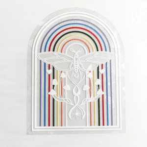 Close-up of suncatcher sticker with moth and mushroom motifs on rainbow static window film