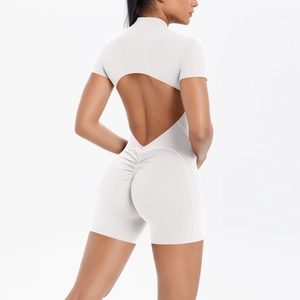 Detailed back view of white yoga jumpsuit with heart-shaped cutout and ruched booty design