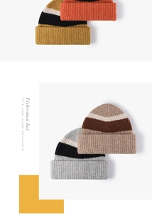 Detailed view of striped and solid color knit wool beanies in various autumn colors