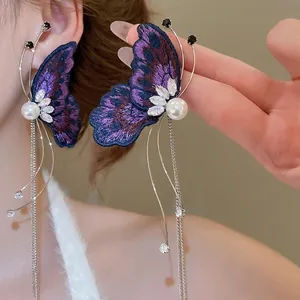 Elegant purple embroidered butterfly earrings with long silver tassels and pearls