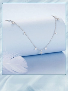 Macro detail of S925 silver starry sky tassel necklace with sparkling star pendants