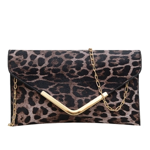Leopard print envelope clutch bag with gold V-metal trim and chain strap on white background