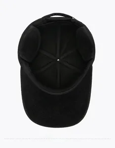 Detail view of thickened thermal lining and ear protection on black wool baseball cap