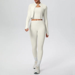 Three-piece yoga set featuring a cropped zip-up jacket with thumbholes and high-waisted leggings
