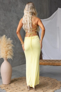 Detail of the criss-cross back straps and open back on this yellow maxi dress