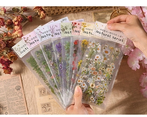 Detail of vintage PET floral stickers in natural series packaging for scrapbooking