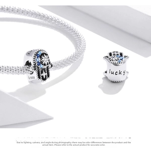 Detailed view of S925 silver Hamsa Hand charm with lucky engraving and blue zircons