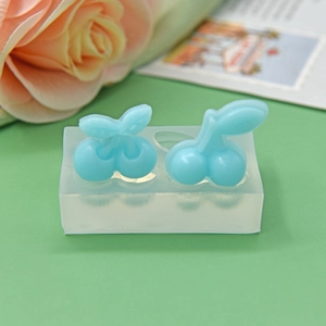 Dual cherry shaped silicone mold for DIY baking and resin crafts in a soft top view