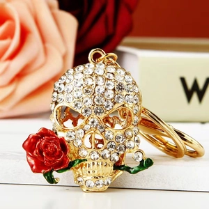 Sparkling gold skull keychain with red rose and crystal rhinestones for bag or car keys
