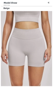 Close-up of seamless ribbed high-waist yoga shorts in white sand color and soft texture