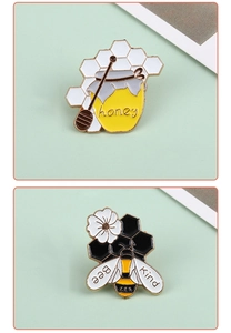 Detail view of honey jar and bee enamel pins featuring Bee Kind quote on light green background