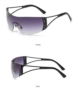 Y2K futuristic cyberpunk sunglasses with gradient lenses and sparkling rhinestone temples.