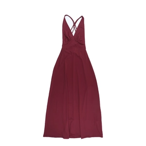Detail of wine red halter dress showing cross-back design and knit texture fabric