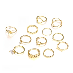 14-piece gold ring set with pearls and crystals showing diverse sizes and designs