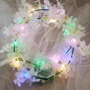 Luminous Hawaii floral headband with white flowers and colorful LED lights on white mesh