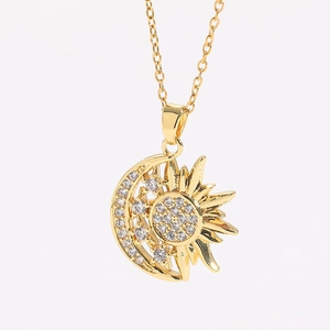 Detail of 14K gold plated sun and moon pendant necklace with micro-set zircon stones