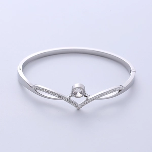Elegant V-shaped titanium steel bangle with sparkling diamonds for women's luxury style
